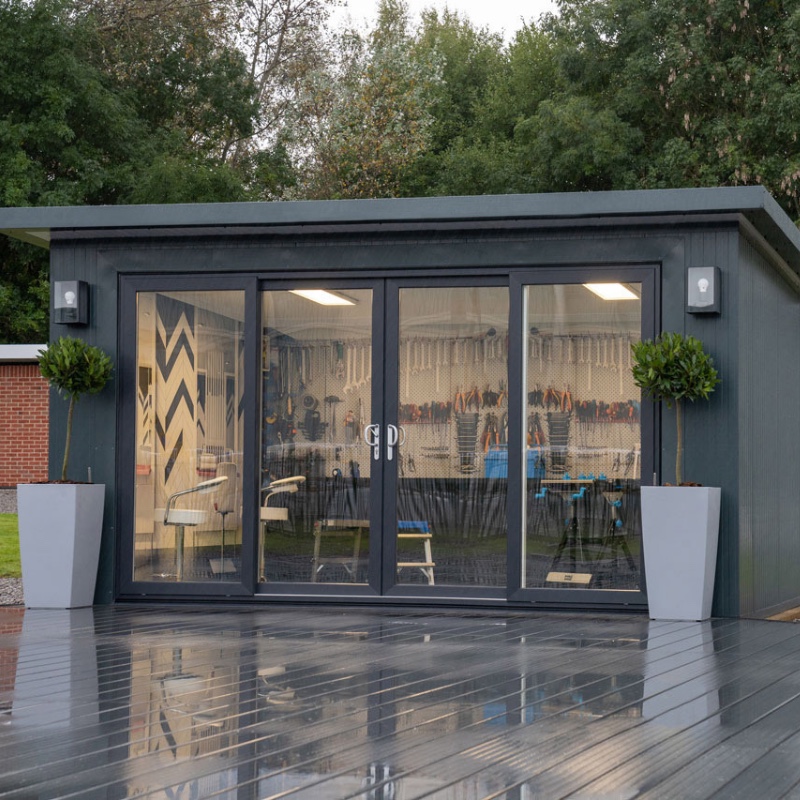 Prefabricated garden room with large glass doors